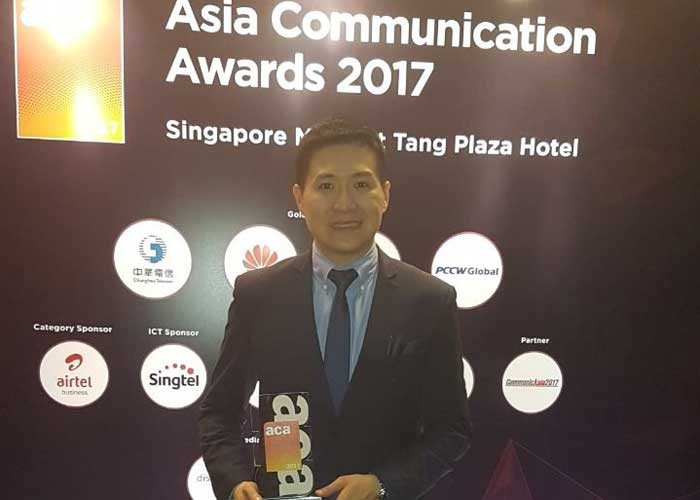 Smart, represented by PLDT SG country manager James Melon, receives the first of two awards at the ACA in Singapore.