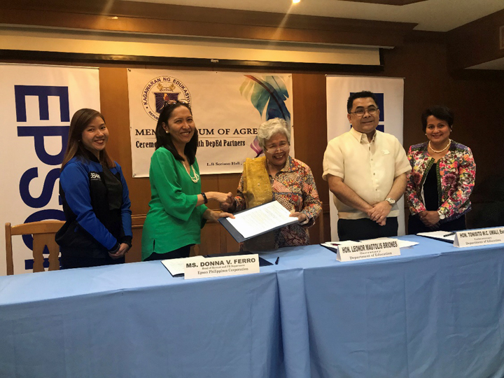 Epson Philippines formalized the company’s commitment to equip less-privileged, deserving public schools with Epson technologies under the Gift of Brightness project. In the photo are DepEd Secretary Honorable Leonor Briones, Undersecretary Tonisito Umali, Director IV for External Partnership Services Margarita Ballesteros. Signing for Epson Philippines is Marketing Communications and PR Head Donna V. Ferro, assisted by Epson Philippines PR Specialist Mica Bayot.
