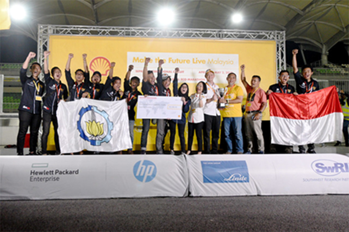 ITS Team Sapuangin, race number 501, from Institut Teknologi Sepuluh Nopember, Indonesia, winners of the UrbanConcept - Gasoline category during day three of Shell Make the Future Live Malaysia 2019 at the Sepang International Circuit on Wednesday, May 1, 2019, south of Kuala Lumpur, Malaysia. Joining the team in victory is Shell General Manager for External Relations–Asia Pacific Xiaowei Liu (tenth from left) and Ministry of International Trade and Industry Deputy Minister Dr. Ong Kian Ming (eleventh from left).
