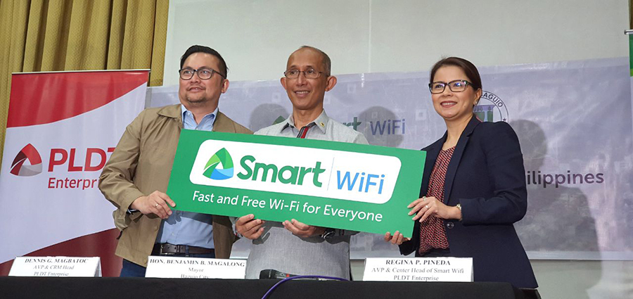 PLDT Enterprise AVP Dennis Magbatoc, Baguio City Mayor Benjamin Magalong and Smart WiFi Head Ina Pineda fired up Smart WiFi in Baguio City Hall