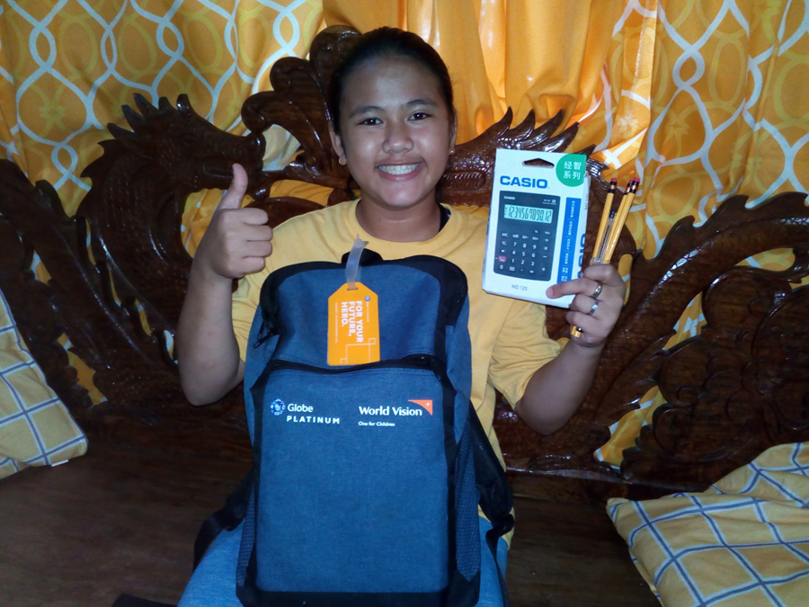 Students in Baseco, Manila receive almost a thousand World Vision school kits raised by Globe Platinum customers